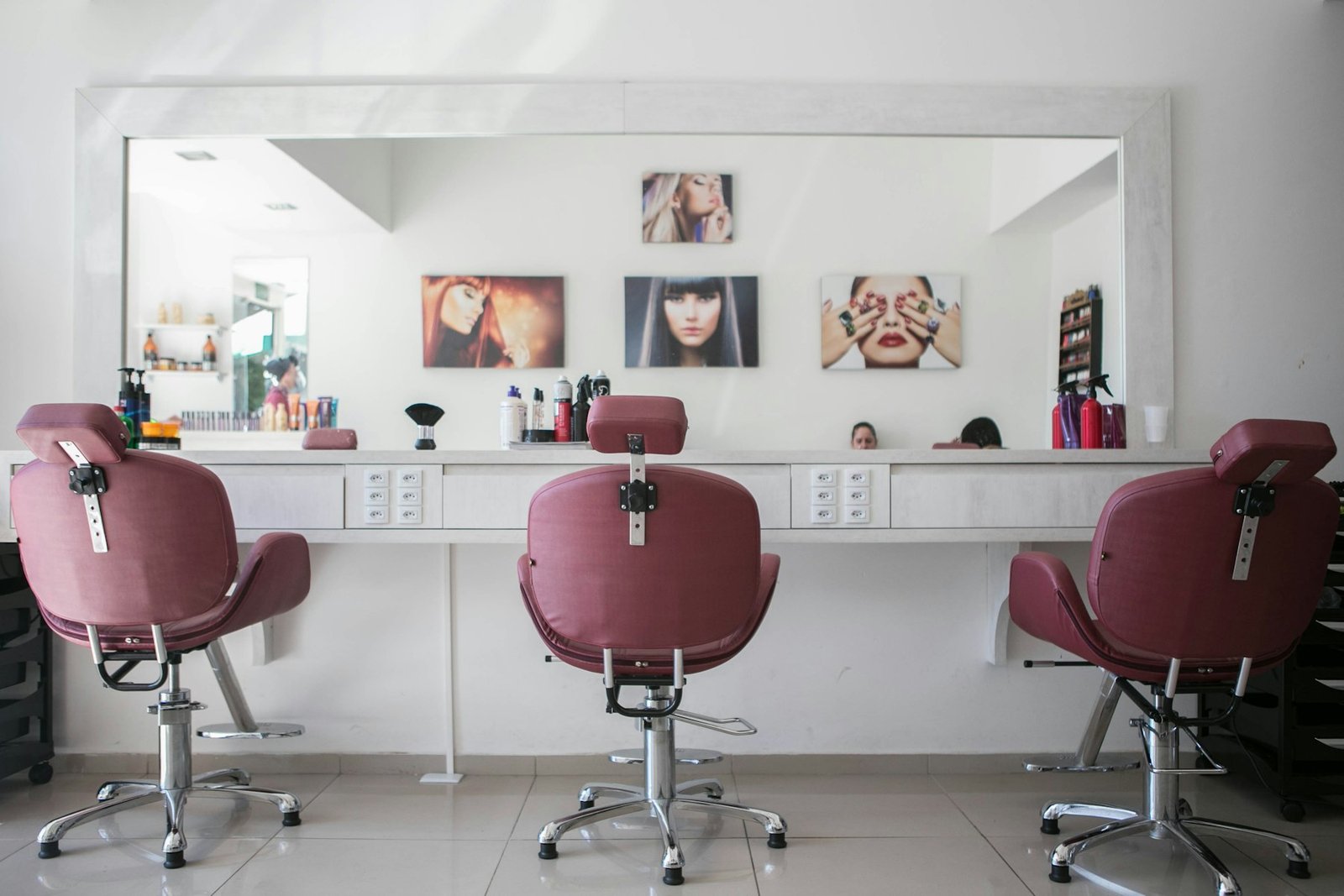 Private salon suite with styling chairs and a large mirror